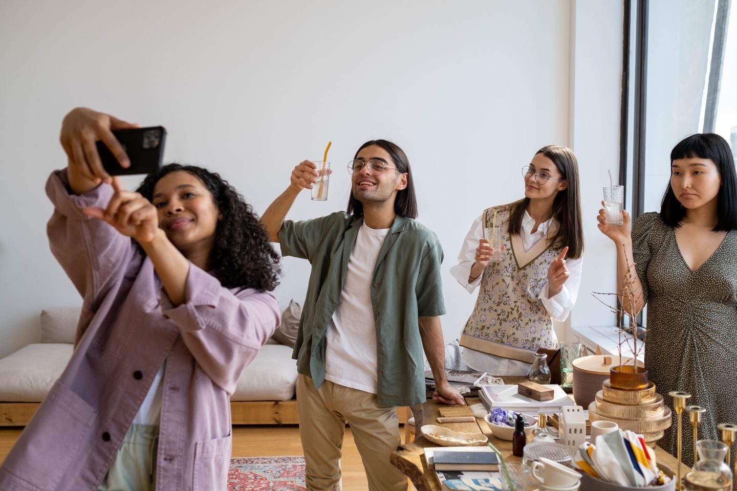 Friends taking a group selfie at a gathering